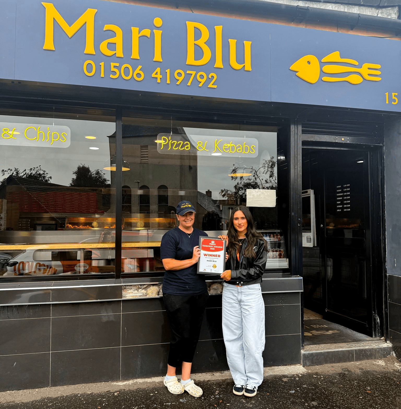 Mari Blu team celebrating Mealzo Award win outside their shop.